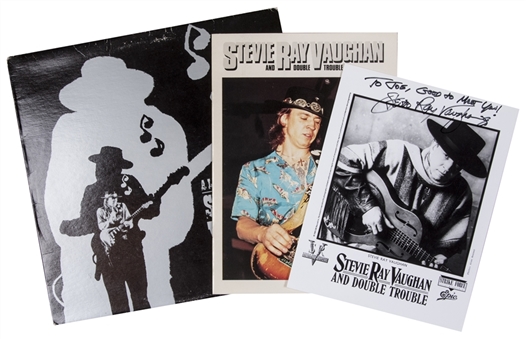 Stevie Ray Vaughan Collection of (3)- Including Autographed/Inscribed Photo, Tour Booklet, and Promo LP (PSA/DNA)